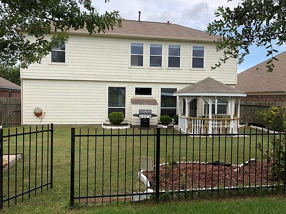 Back of the house with a gazebo