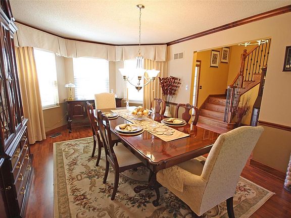 Large formal dining room with bay window.