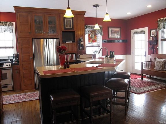 The side door you see is the entrance from the little porch on the right of the home by the front parking spaces.The breakfast bar is a great gathering place.  Note the stove to the left rear - I'll tell you more about that later.