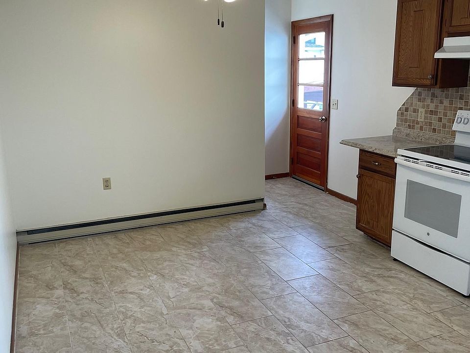 Kitchen with secondary exit to ramp which goes to rear alleyway. Easy access for unloading items without needing to use stairs.
