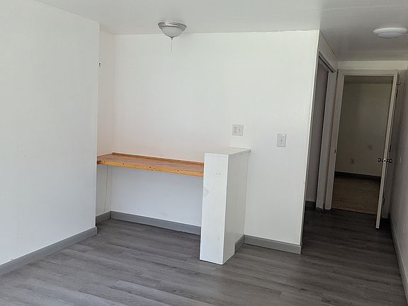 Entryway and bedroom (windows directly behind)