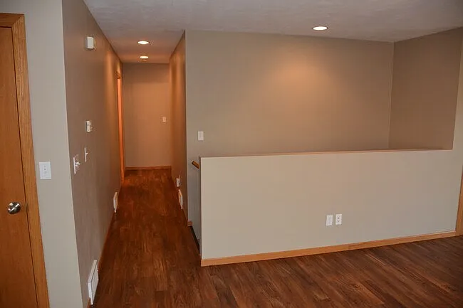 Hallway and stairway leading to lower level