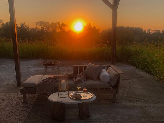 shared sunset view platform with pergola and barbeque