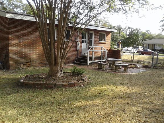 Back of house, stone patio, handrails