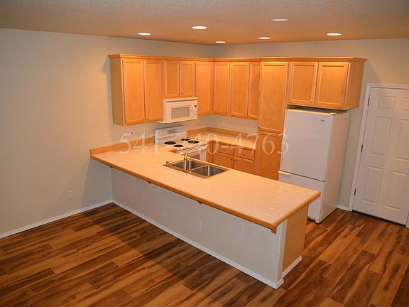 Tile countertops; beautiful, new easy-care laminate flooring.