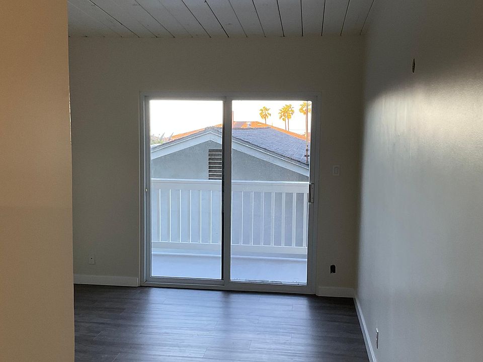 Bedroom. Check out the wood ceiling with tongue and groove wood vaulted ceiling. Super beachy