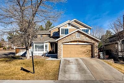 Front of home on corner lot and charming front porch