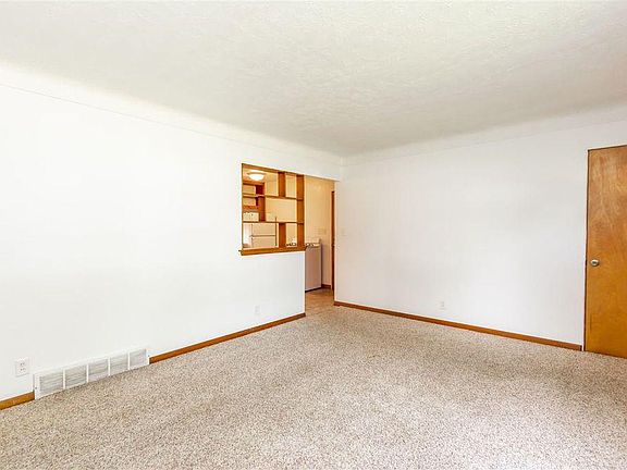 Another living room view looking towards kitchen