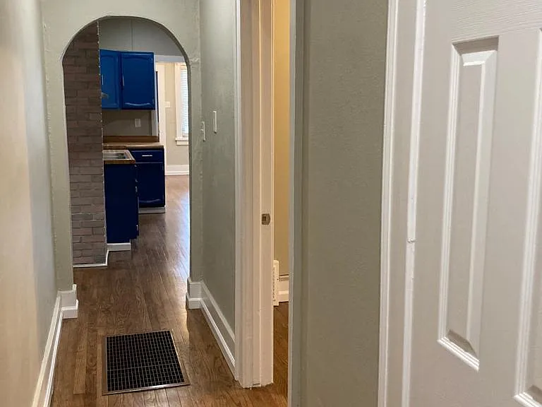Hallway to both bedrooms and bathroom.