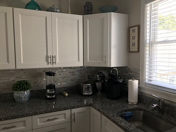 Kitchen with many cabinets.