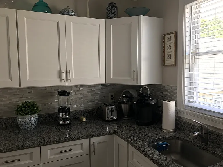 Kitchen with many cabinets.