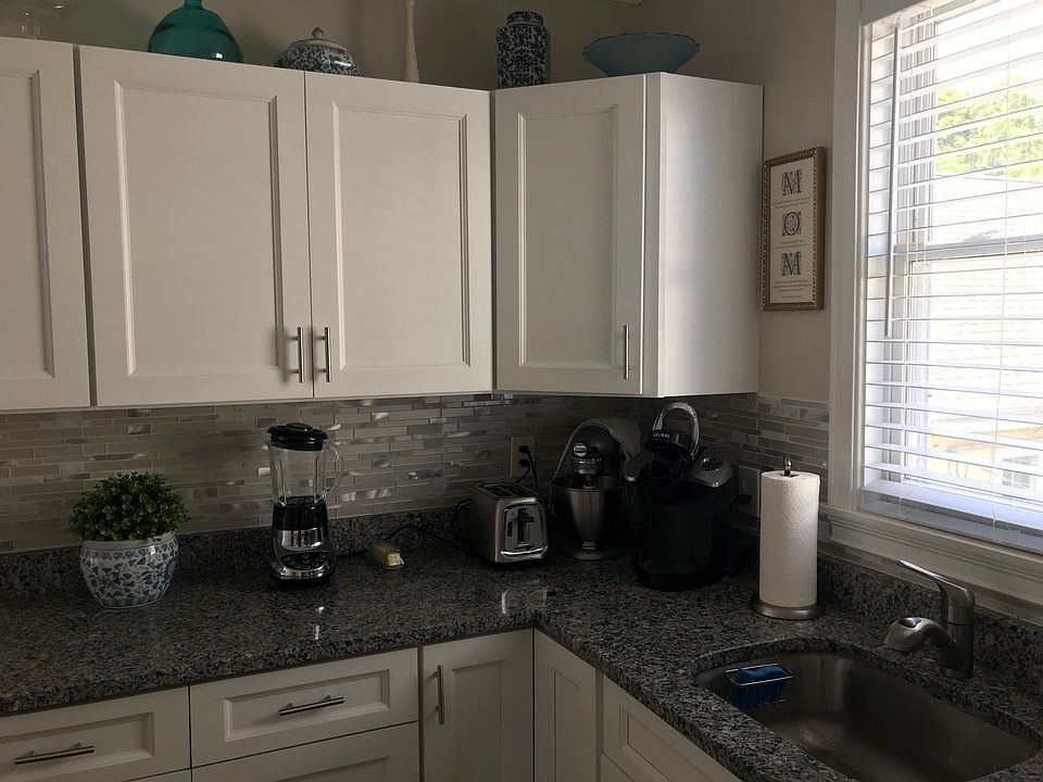 Kitchen with many cabinets.