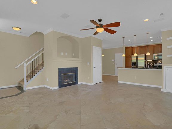 Family Room with Travertine Tile Floors, New Paint, and Gas Fireplace