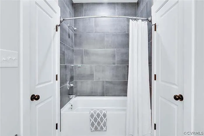 Upstairs bathroom. Door on the sides lead into Bedrooms 2&3.