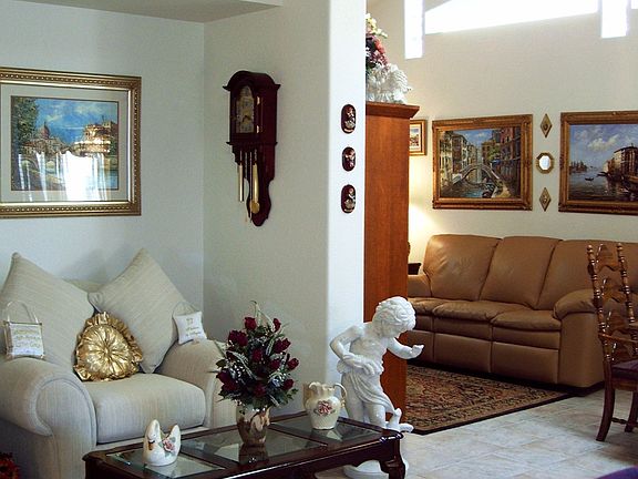 Living Room with Pot Shelves and Ceiling Fan