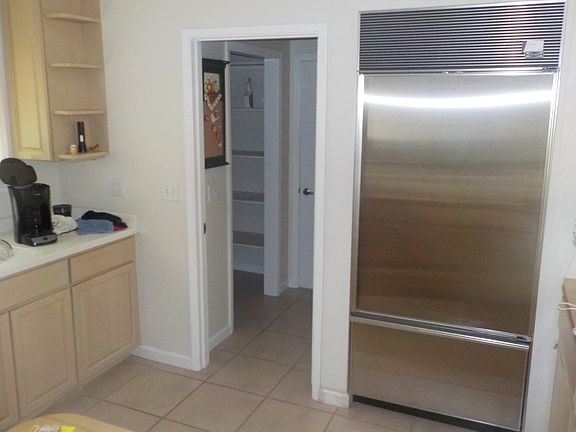 SubZero refrigerator and access to interior laundry room