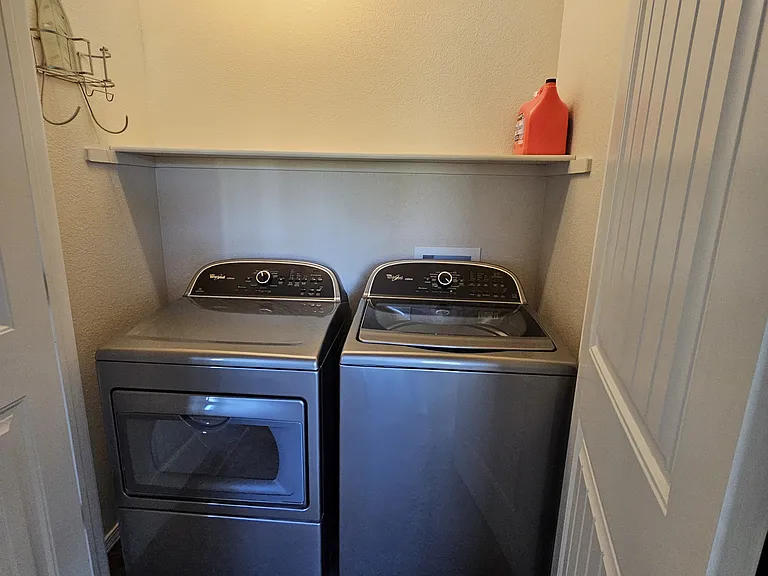 laundry closet upstairs with washer & dryer