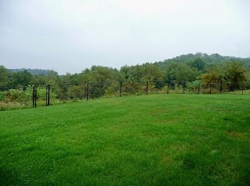 Level, fenced yard with no houses blocking your view!