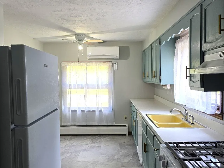 large, bright eat-in kitchen with plenty of storage