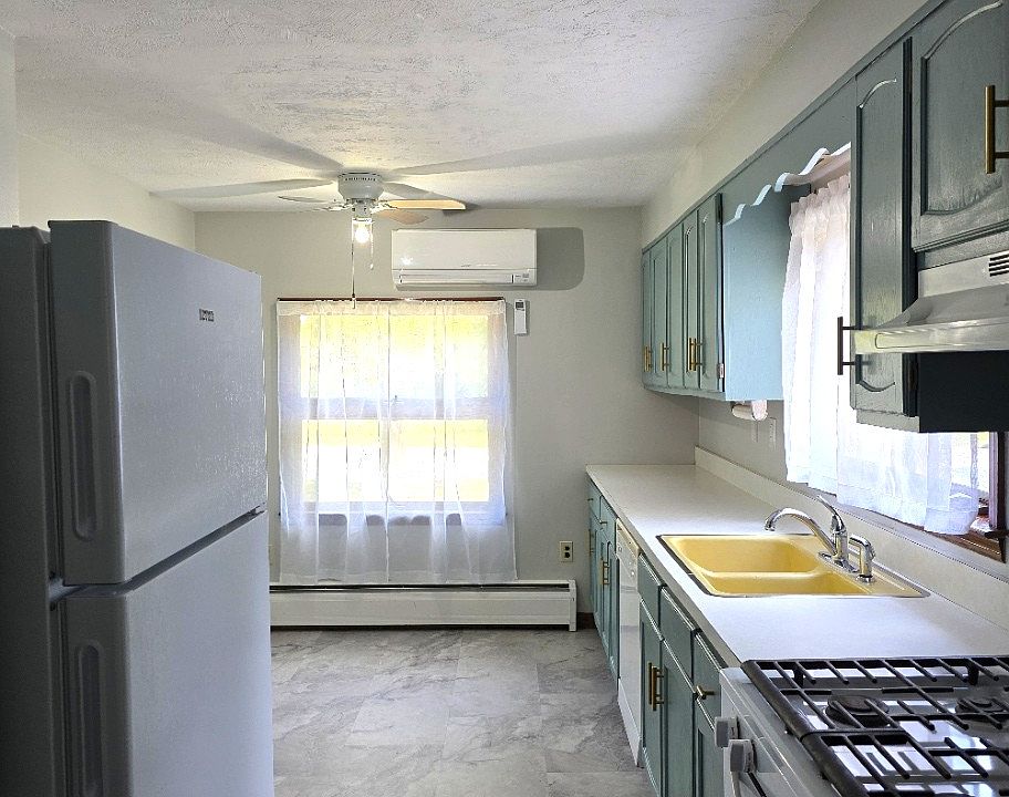 large, bright eat-in kitchen with plenty of storage