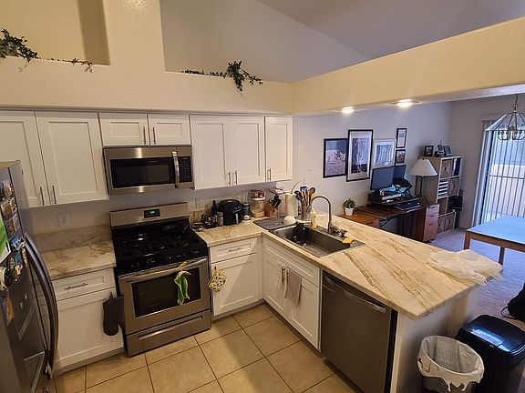 Open concept shared kitchen. Faces Dining Room area / office space. A few cupboards are left empty for future tenant's belongings but also willing to share existing items. We do recycle.