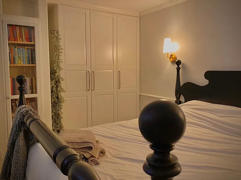 Built in bedroom bookshelf and custom wardrobe.