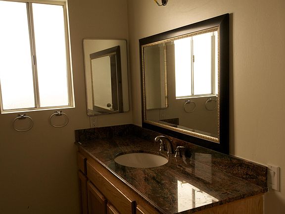 Master bathroom with tile flooring