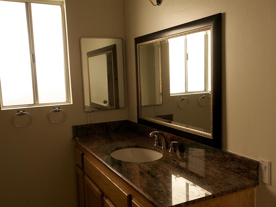 Master bathroom with tile flooring