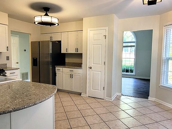 kitchen opens to dining room
