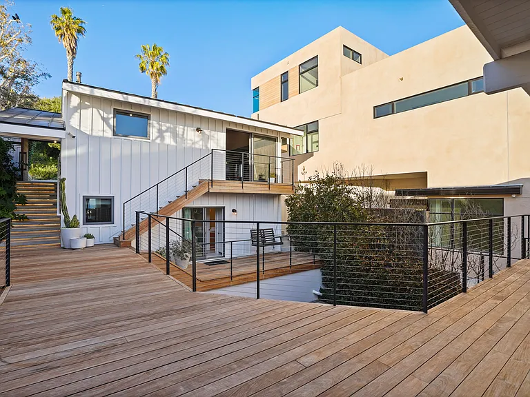 A warm welcome awaits with coastal charm and seamless indoor-outdoor flow.