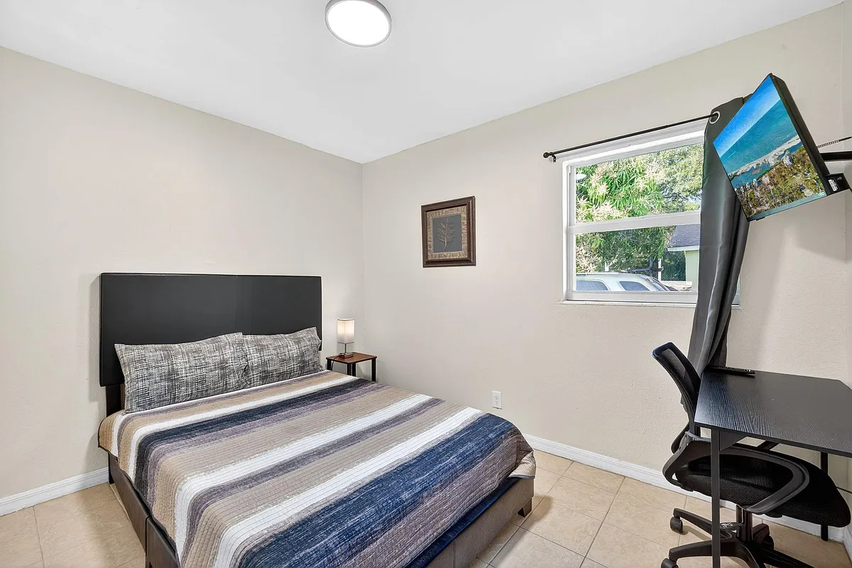 Photo 1 of 10 - Aquarius Ct - Fort Myers, FL Labeled Room #10 with a Full-Size Bed, Smart TV, Desk & Chair, Closet - Aquarius Ct