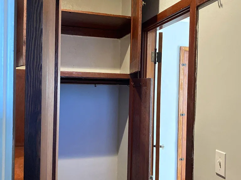 Inside the dressing area and showcasing the ample closet space!