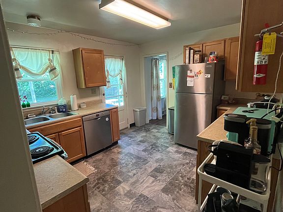 Kitchen includes newer appliances (including a dishwasher), lots of cabinets, and direct access to the backyard (for easy grilling/hosting).