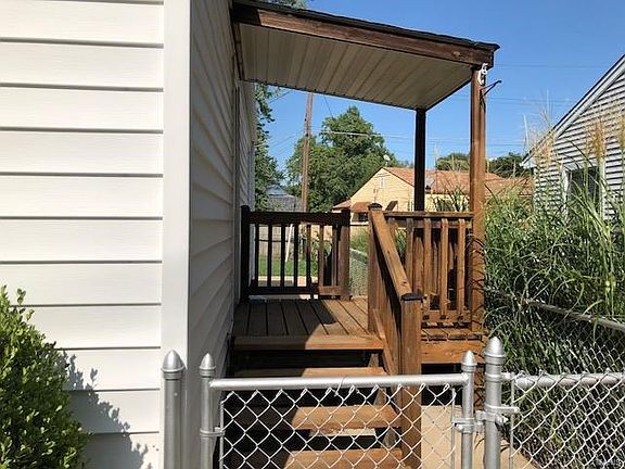 Deck on side of home for outdoor fun and privacy!