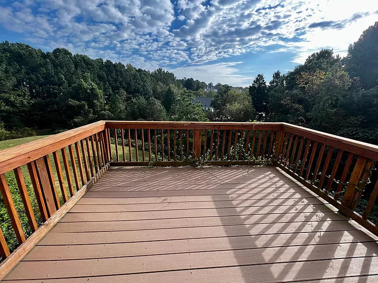 Large upstairs deck with beautiful views of the trees! There is no one to the right of you so it feels like an end unit with total privacy