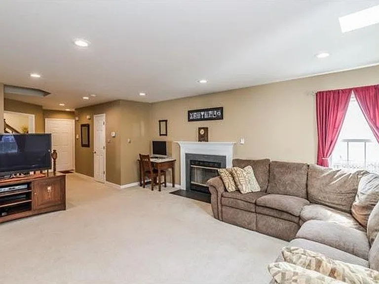 Family Room. All carpet shown has been replaced with beautiful hardwood flooring.