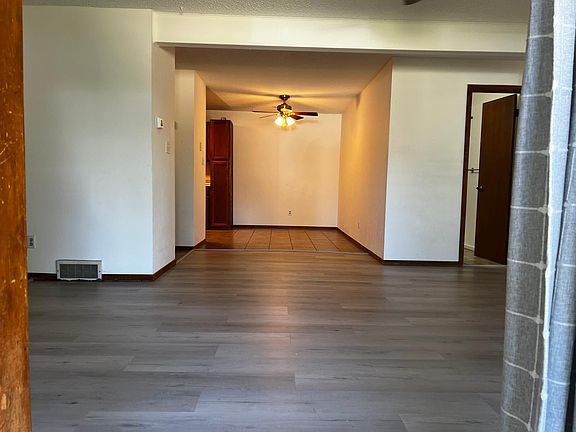 Walking into living area towards Dining and Kitchen