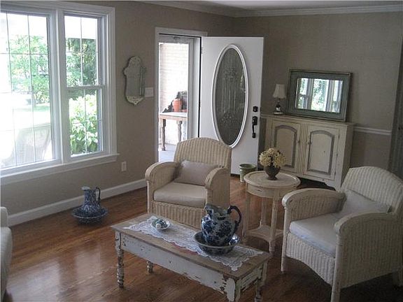 Enter into the Living Room with Hardwood Floors