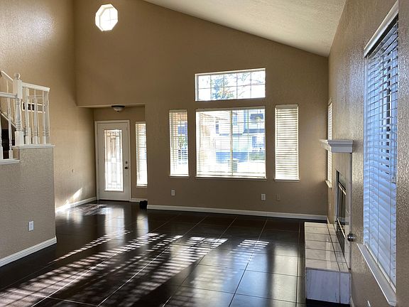 Grand entry to formal dining and living room with fireplace