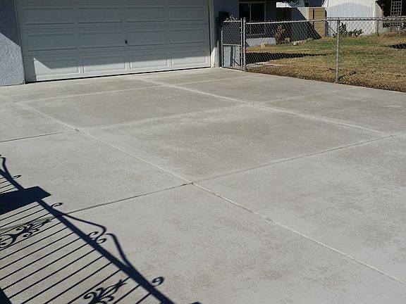 Concrete driveway with small RV parking