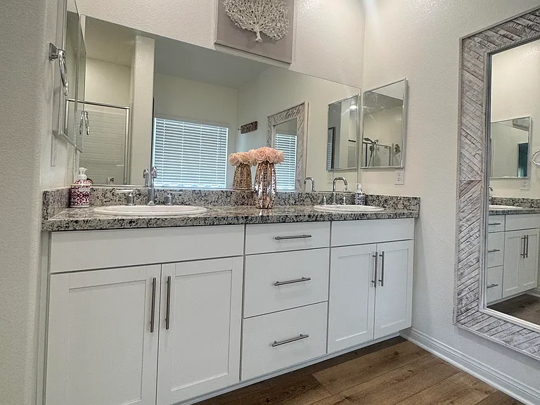 Dual vanity with granite and large drawers for storage