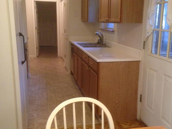 Galley style kitchen with updated appliances