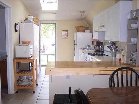 Sunny and bright describe this kitche with vaulted ceiling and skylight!