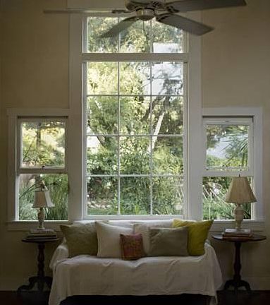 East facing large (8 1/2') windows with original 1930s glass windowpanes in great room overlooking garden.