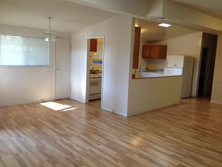 Large open floor plan with wood floors