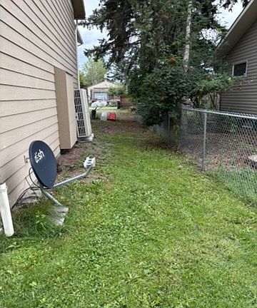 side yard going to stairs up to deck