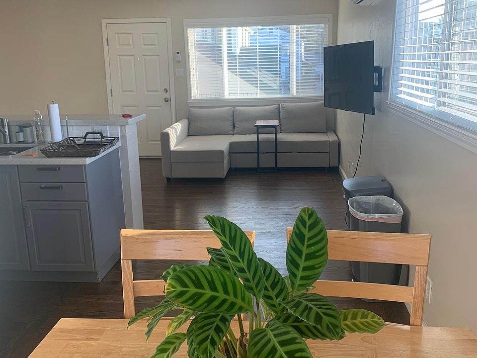 Open kitchen living room with dining nook.