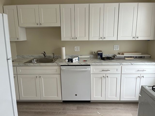 Kitchen - showing new cabinets, countertops and dishwasher