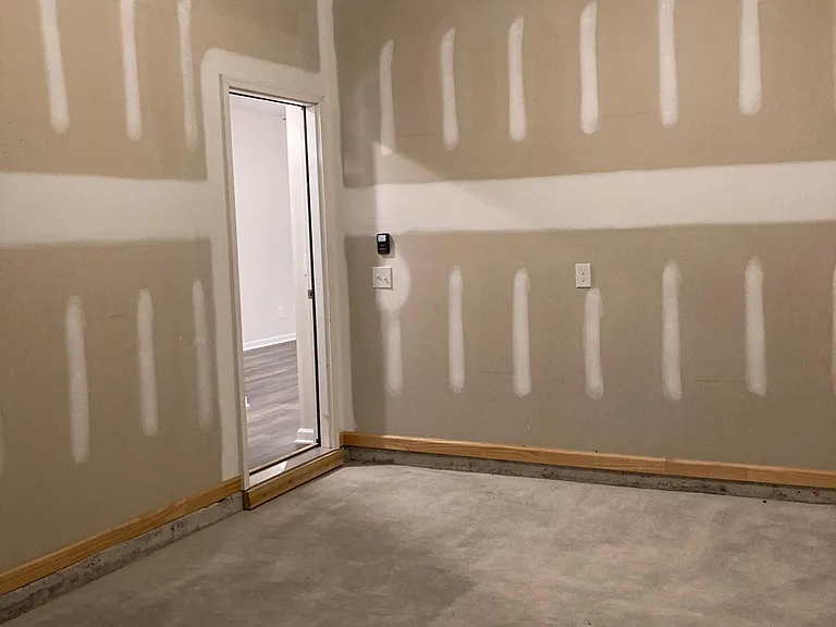 Garage view showing door into house.