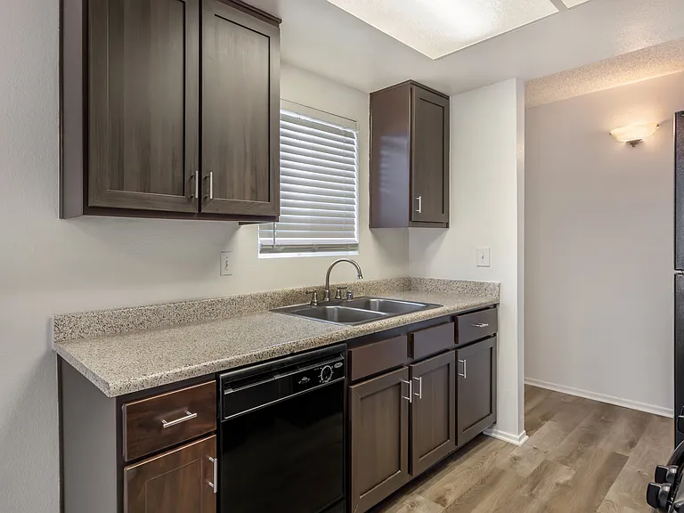 Sedona Apartments in Moreno Valley offers renovated units with sleek black appliances and modern chocolate-colored cabinets for stylish, comfortable living.